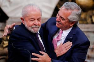 Alberto Fernández in a friendly embrace with Lula da Silva
